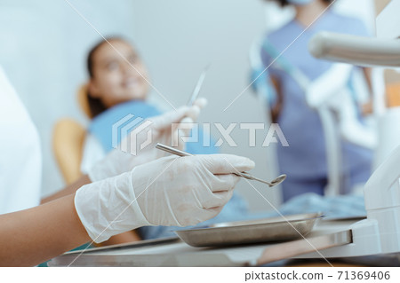 Treatment of toothache in children in modern dental clinic 71369406