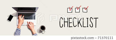 Checklist with person using laptop Checklist with person using laptop 71370111