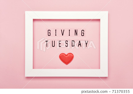 Giving Tuesday text message and Red hearts in white frame. Global day of charitable giving after Black Friday shopping day Giving Tuesday text message and Red hearts in white frame. Global day of charitable giving after Black Friday shopping day 71370355