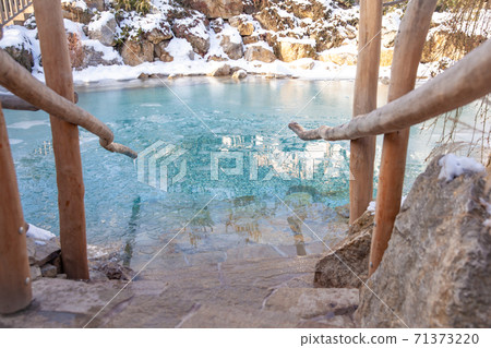 lake with ice water in winter for cooling after sauna lake with ice water in winter for cooling after sauna 71373220