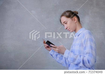 Online shopping concept - woman using smartphone and credit card Online shopping concept - woman using smartphone and credit card 71374049