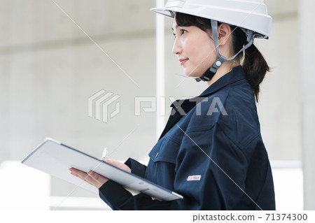 Portrait of female construction management Portrait of female construction management 71374300