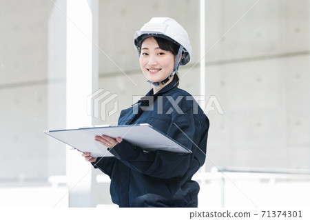Portrait of female construction management Portrait of female construction management 71374301