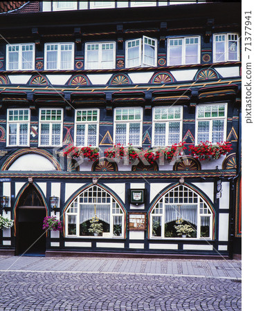 German half-timbered house windows and flowers German half-timbered house windows and flowers 71377941