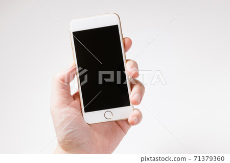 Smartphone and hand_3 71379360