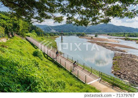 Riding a bicycle 71379767