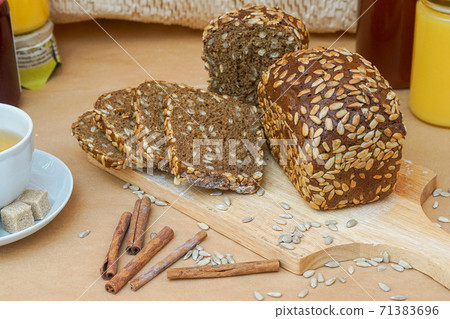 Grain baked brean on wooden board  71383696