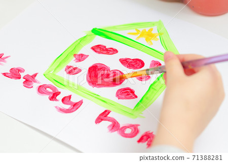 Child is drawing hearts into house. Child is drawing hearts into house. 71388281