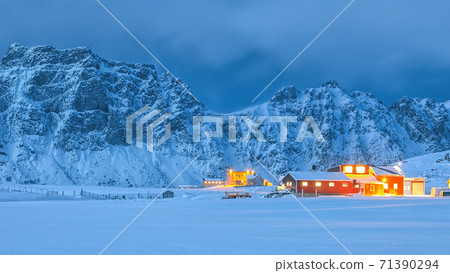 Fantastic evening illumination of traditional Norwagian houses in Utakleiv village Fantastic evening illumination of traditional Norwagian houses in Utakleiv village 71390294