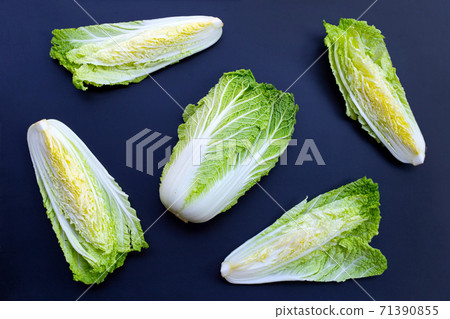 Chinese cabbage on dark background. Chinese cabbage on dark background. 71390855