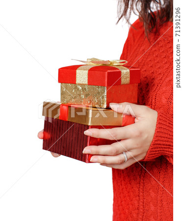 Young woman with Gift boxes in hands e close up Young woman with Gift boxes in hands e close up 71391296