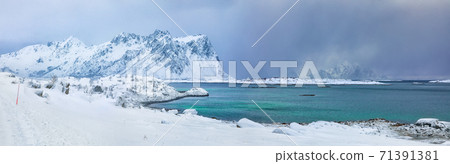 Fabulous snowy winter scene of Vestvagoy island with snowy mountain peaks on Lofoten Islands Fabulous snowy winter scene of Vestvagoy island with snowy mountain peaks on Lofoten Islands 71391381