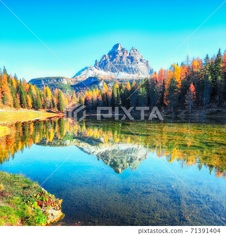 Stunning view of popular travel destination mountain lake Antorno in autumn Stunning view of popular travel destination mountain lake Antorno in autumn 71391404