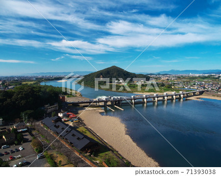 View of Kiso River and Line Ohashi from Inuyama Castle, a national treasure in the autumn sky View of Kiso River and Line Ohashi from Inuyama Castle, a national treasure in the autumn sky 71393038