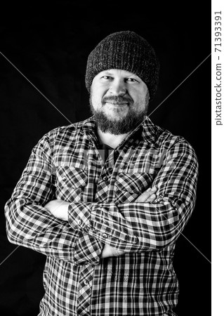 Solid bearded man in a wool cap portrait 71393391