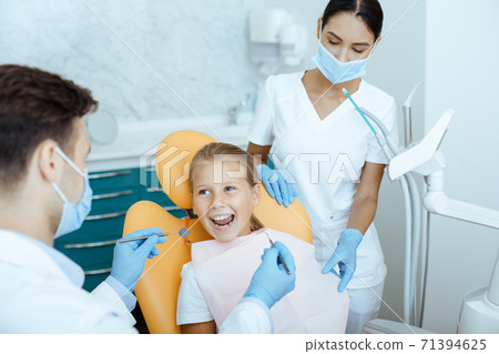 Fast, painless and modern examination and treatment of oral cavity 71394625
