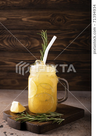 homemade lemonade with lemon wedges and ice 71394934