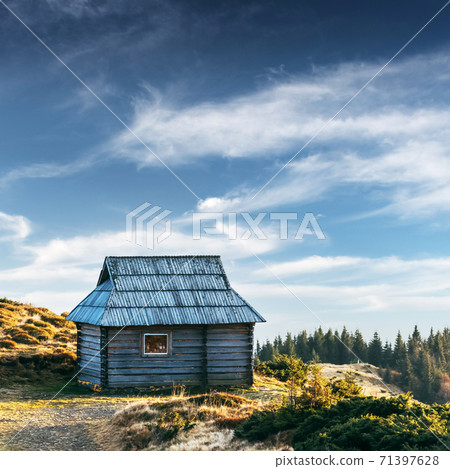 Mountain cabin during sunrise Mountain cabin during sunrise 71397628