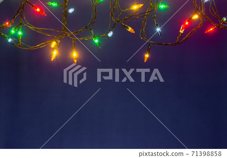 Christmas lights on blue background with copy space 71398858