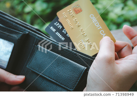 Woman hand open wallet showing credit card Woman hand open wallet showing credit card 71398949