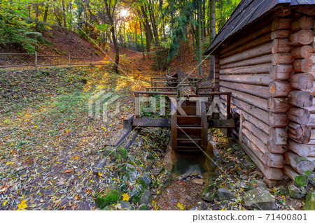 An old wooden water mill. An old wooden water mill. 71400801