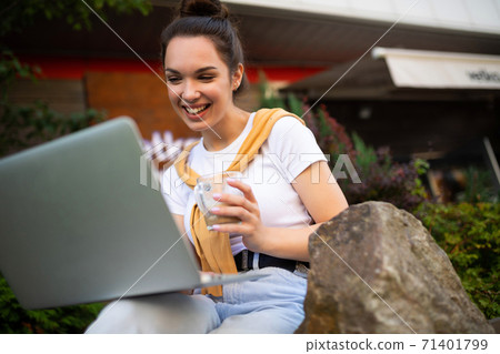 business woman working at the computer on the street business woman working at the computer on the street 71401799
