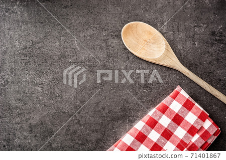 Wooden spoon and checkered tablecloth Wooden spoon and checkered tablecloth 71401867