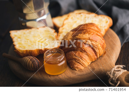 Croissants with jam on wooden board Croissants with jam on wooden board 71401954
