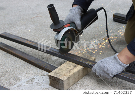 Cutting metal structures with an angle grinder. Cutting metal structures with an angle grinder. 71402337