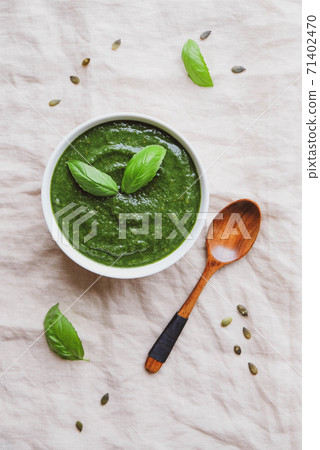 A bowl of hot healthy green vegetable cream soup, from above. A bowl of hot healthy green vegetable cream soup, from above. 71402470