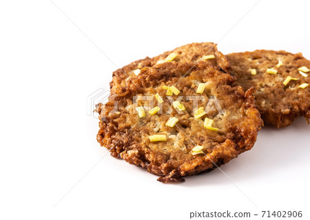 Traditional Jewish latkes or potato pancakes 71402906