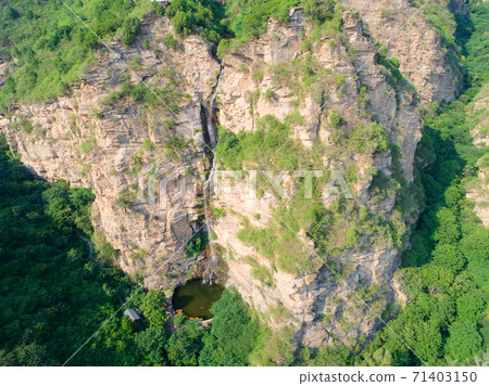 Natural waterfall in the mountain Natural waterfall in the mountain 71403150