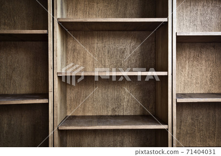 Empty wooden book shelf with or storage rack modern retro design, copy space background texture Empty wooden book shelf with or storage rack modern retro design, copy space background texture 71404031