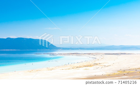 Aerial view over the clear beach and turquoise water of Salda lake. Burdur Province, Turkey Aerial view over the clear beach and turquoise water of Salda lake. Burdur Province, Turkey 71405216