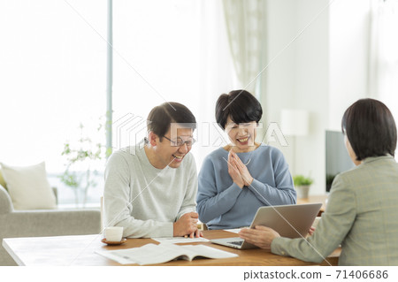 Senior couple and business woman having a business talk 71406686