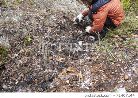 big amount of trash in forest, family father and son picking garbage away, global environment issues big amount of trash in forest, family father and son picking garbage away, global environment issues 71407144