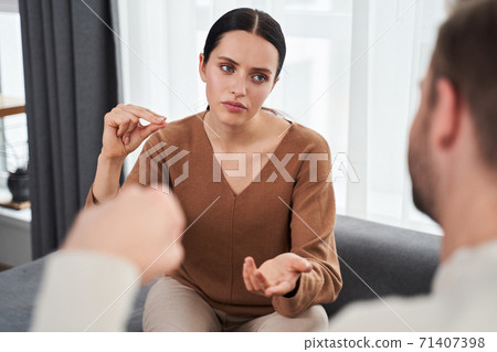 Deaf couple discussing some important problems Deaf couple discussing some important problems 71407398