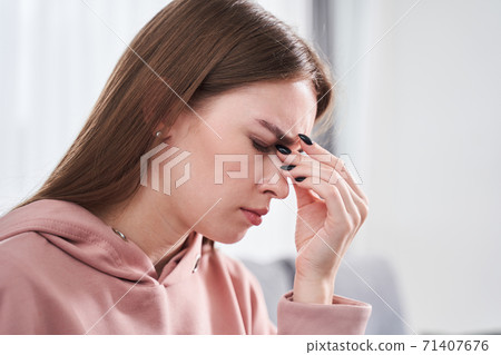 Girl rubbing dry eyes Girl rubbing dry eyes 71407676