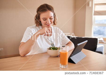 Woman eating healthy salad Woman eating healthy salad 71408367