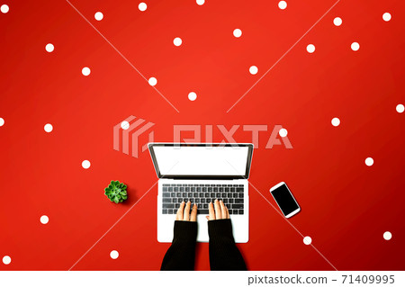 Person using a laptop computer Person using a laptop computer 71409995