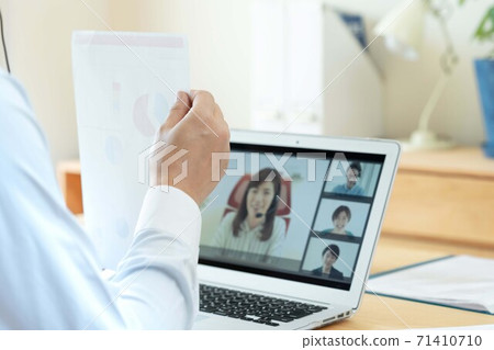 Men having an online meeting 71410710