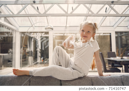 Little daughter stay at home on quarantine Little daughter stay at home on quarantine 71410747