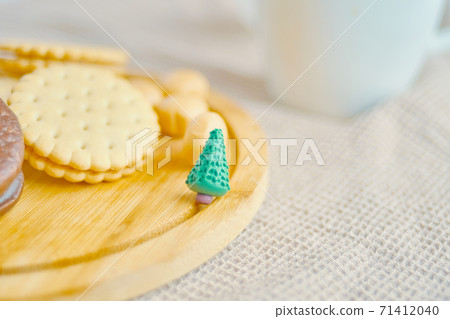 Cookies and cakes on a wooden tray. Cookies and cakes on a wooden tray. 71412040