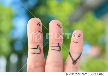 Fingers art of happy family. Concept parents are proud of their child. 71413879