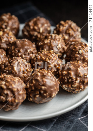 Sweet chocolate truffles. Tasty belgian pralines balls. Sweet chocolate truffles. Tasty belgian pralines balls. 71414445