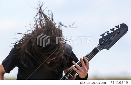 Long hair on the head of a rock musician Long hair on the head of a rock musician 71416249