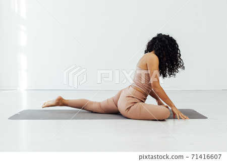 Woman engaged in yoga class asana gymnastics fitness sport 71416607