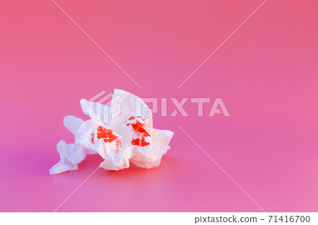 Toilet paper and blood. Concept of hemorrhoid treatment. 71416700