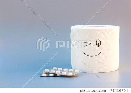 Toilet paper and pills. Concept of hemorrhoid treatment. Toilet paper and pills. Concept of hemorrhoid treatment. 71416704