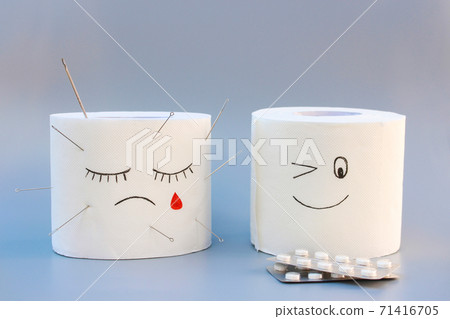 Toilet paper and pills. Concept of hemorrhoid treatment. 71416705